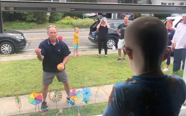 A Kid with Cancer Can’t Go Outside, So People Are Entertaining Him Through His Front Window