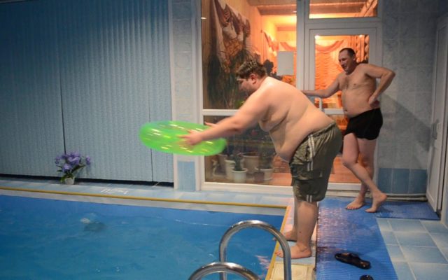 Watch This Hefty Dude Dive Through a Small Pool Toy