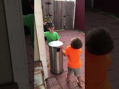 Little Boys Take Turns Getting Hit in the Face with a Garbage Can Lid