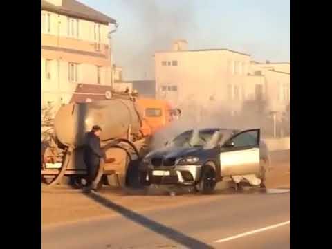 A Driver in Russia Sprays His Burning Car with Waste from a Septic Truck