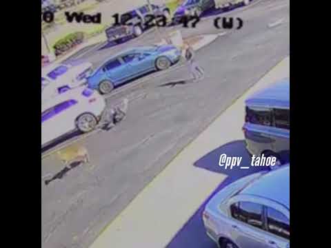 A Guy Walking in a Parking Lot Gets Barreled-Over by a Deer