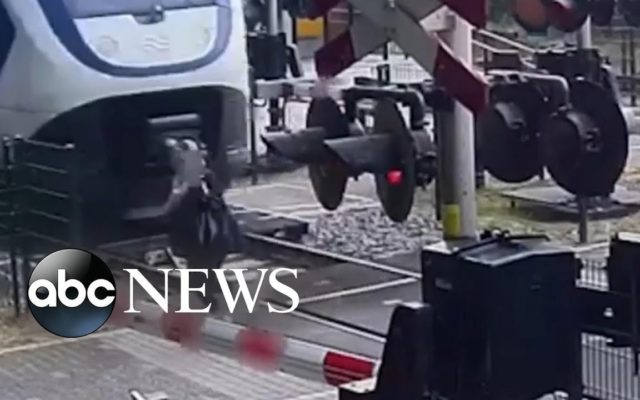 A Woman Comes Inches Away from Being Hit by a Train