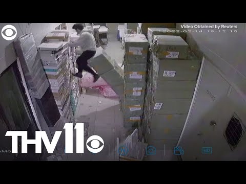 A Distracted Guy Falls Through a Hole, and Is Saved by a Stack of Boxes